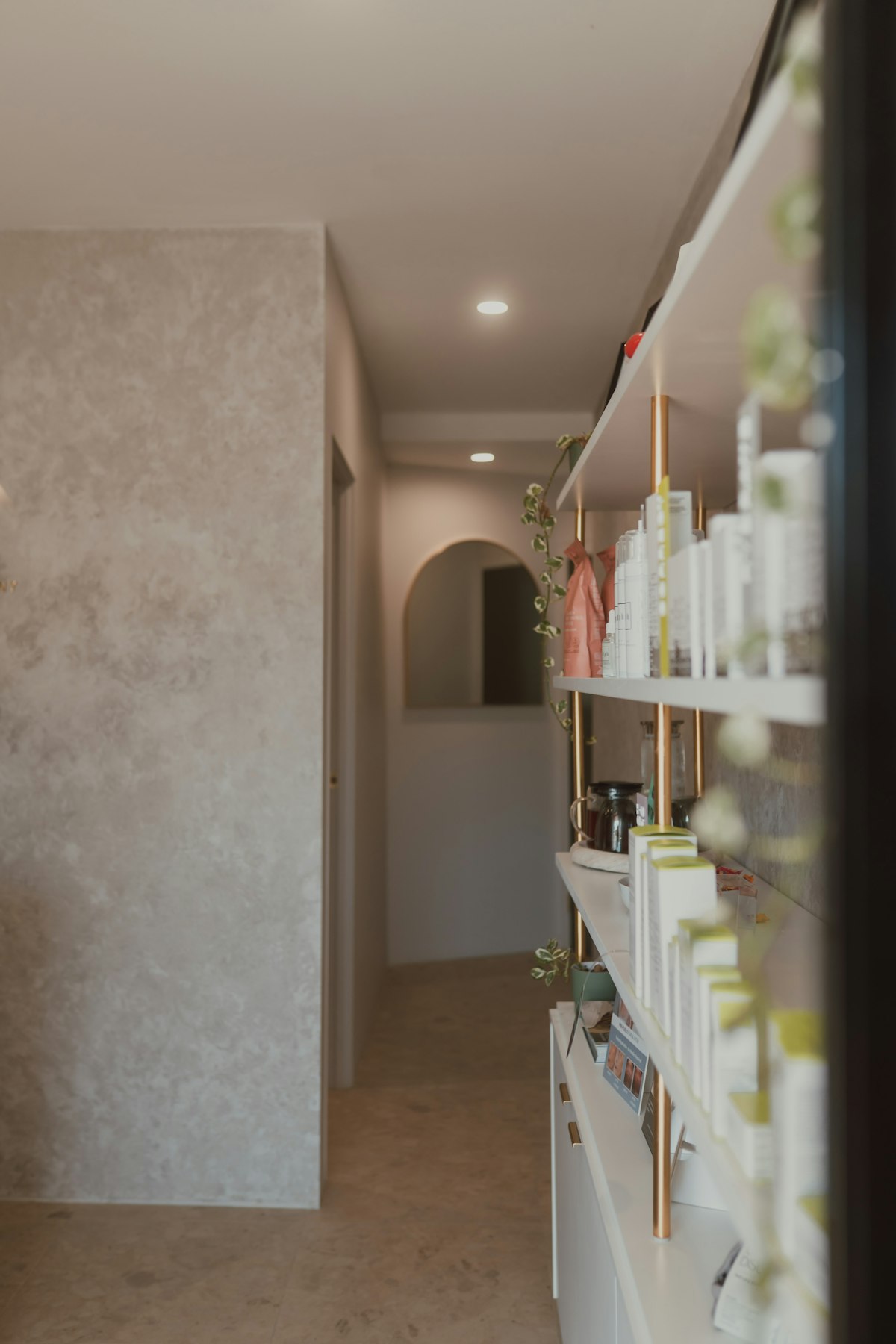 Skincare products displayed in a premium clinic interior